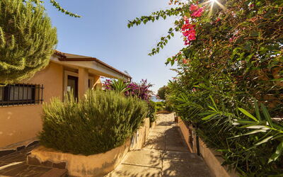 Trilocale Apartments Seaside: Shrub, Home, Garden, Landscaping, Shade, Driveway, Yard, Hacienda, Walkway, Backyard