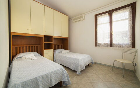 Villino Trilocale Apartments Seaside: Floor, Interior Design, Bedroom, Bed, Flooring, Apartment, Furniture, Room, Bed Frame, Ceiling