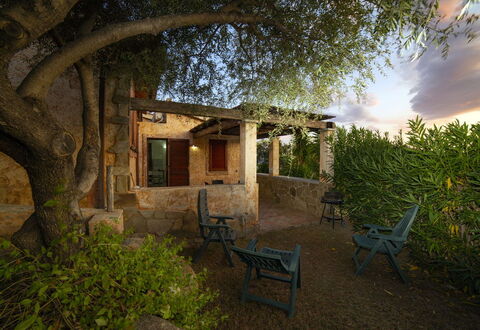 Villino Trilocale Apartments Seaside: Furniture, Garden, Shade, Outdoor Furniture, Backyard, Landscaping, Wood Stain, Outdoor Structure, Chair, Hacienda