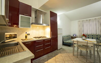 Trilocale Villa 2: Kitchen, Kitchen Appliance, Flooring, Interior Design, Major Appliance, Countertop, Wood, Floor, Furniture, Ceiling