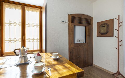 Morelli: Table, Tableware, Property, Furniture, Building, Wood, Coffee Cup, Drinkware, Dishware