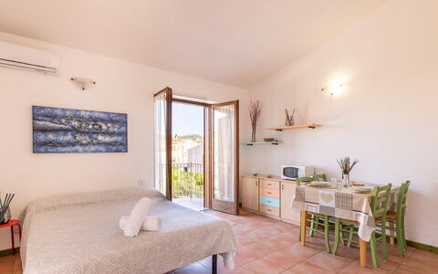 Casa Pavoncelle Apartments In Gallura: Wall, Apartment, Home, Balcony, Chair, Houseplant, Porch, Hotel, Outdoor Furniture, Villa