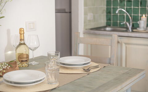 Casa D'orso Green Village Sardegna: Furniture, Tableware, Dishware, Table, Tap, Sink, Cabinetry, Wood, Interior Design, Drinkware