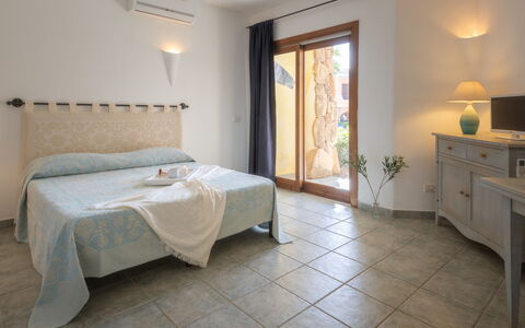 Casa D'orso Green Village Sardegna: Furniture, Property, Cabinetry, Comfort, Table, Wood, Interior Design, Lighting, Flooring, Building