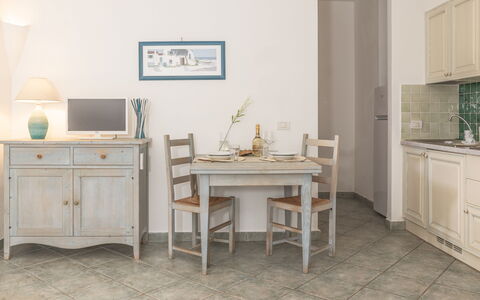 Casa D'orso Green Village Sardegna: Table, Cabinetry, Furniture, Property, Building, Desk, Drawer, Chair, Lighting, Computer Desk