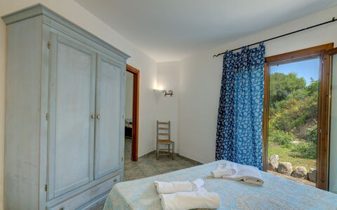 Casa Faro Green Village Sardegna: Property, Azure, Wood, Lighting, Interior Design, Floor, Door, Flooring, Shade