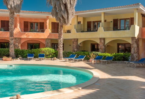 Casa Faro Green Village Sardegna: Water, Plant, Building, Property, Window, Azure, Architecture, Tree, Sky, Leisure