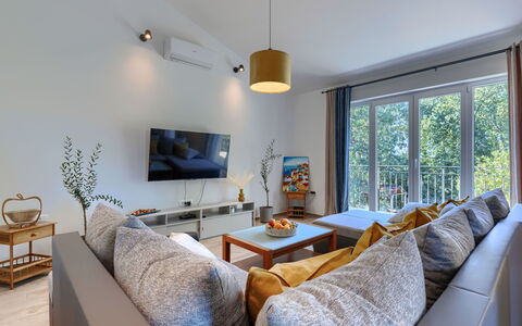 Fameja: Furniture, Interior Design, Couch, Flooring, Wood, Living Room, Floor, Room, Ceiling, Table
