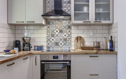 Fameja: Kitchen, Countertop, Kitchen Appliance, Cabinetry, Major Appliance, Interior Design, Flooring, Floor, Tile, Cupboard