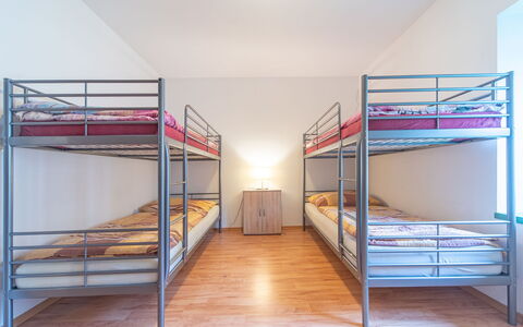 Klobasná: Bunk Bed, Flooring, Floor, Interior Design, Ceiling, Room, Dormitory, Wood Flooring, Bedroom, Bed