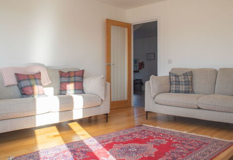 Carbost Cottage: Couch, Flooring, Floor, Interior Design, Wood, Furniture, Living Room, Room