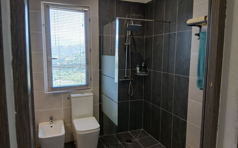 Villa dei Sogni: Plumbing Fixture, Toilet Seat, Bathroom, Toilet, Flooring, Floor, Interior Design, Plumbing, Tile, Glass