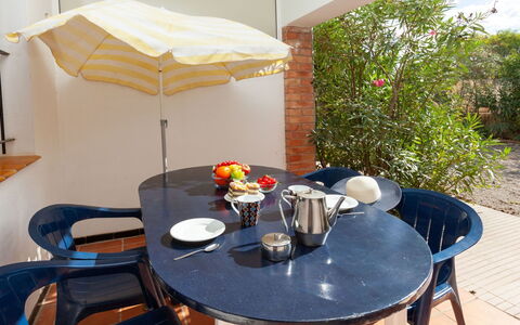 L'Escala 190: Table, Plant, Furniture, Property, Tableware, Outdoor Table, Flowerpot, Chair, Outdoor Furniture, Wood