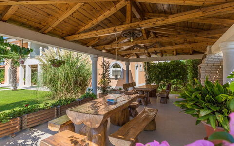 Villa Vizula: Garden, Shade, Outdoor Structure, Resort, Porch, Column, Estate, Backyard, Landscaping, Chair