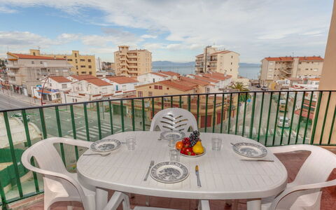 Sol i Mar: Sky, Cloud, Table, Building, Furniture, Property, Chair, Tableware, Outdoor Table, Wood