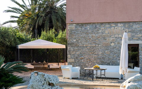 Villa dello Zingaro: Furniture, Shade, Outdoor Furniture, Chair, Flowerpot, Resort, Eco Hotel, Garden, Flagstone, Landscaping