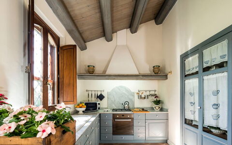 Villa del Sirio: Furniture, Interior Design, Kitchen, Wood, Flooring, Home, Cabinetry, Countertop, Ceiling, Lighting