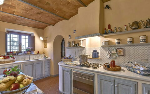 Villa Lucente: Furniture, Interior Design, Kitchen, Flooring, Countertop, Cabinetry, Home, Lighting, Room, Ceiling