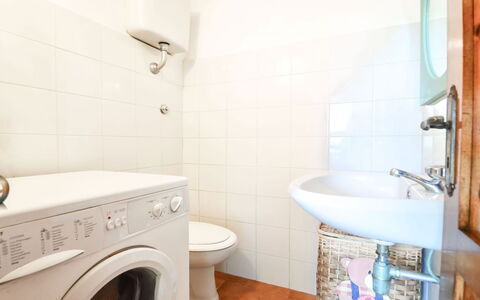 Villa Campanella: Flooring, Floor, Plumbing Fixture, Interior Design, Bathroom, Toilet, Toilet Seat, Washing Machine, Ceiling, Room
