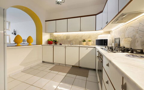 Villa Luce: Kitchen, Interior Design, Flooring, Countertop, Cabinetry, Kitchen Appliance, Ceiling, Lighting, Floor, Major Appliance