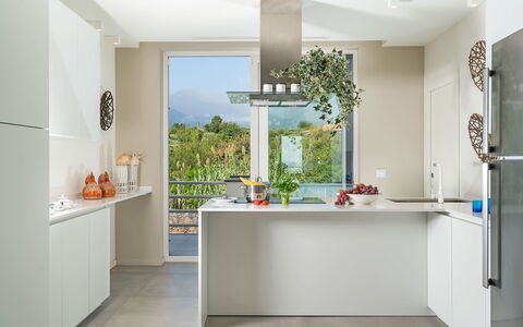Villa del Faro: Kitchen, Countertop, Furniture, Kitchen Appliance, Interior Design, Cabinetry, Flooring, Major Appliance, Wood, Floor