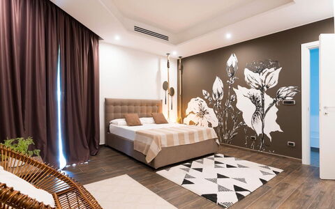 Villa Vernissage: Furniture, Interior Design, Bed, Floor, Flooring, Bedroom, Wall, Room, Wood, Ceiling