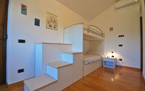 Villa Sarzana: Interior Design, Flooring, Floor, Wood, Bedroom, Furniture, Ceiling, Room, Bed, Lighting