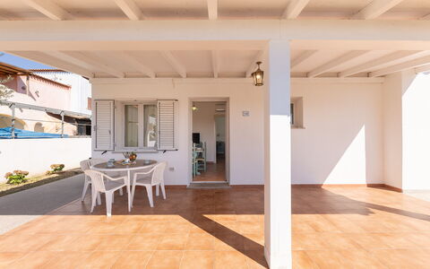 Apartments In Golfo Orosei: Flooring, Floor, Door, Home, Porch, Wood Stain, Shade, Hardwood, Balcony, Deck
