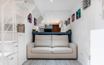 Duomo In 8 Stop: Furniture, Interior Design, Couch, Flooring, Floor, Wall, Wood, Room, Living Room, Apartment