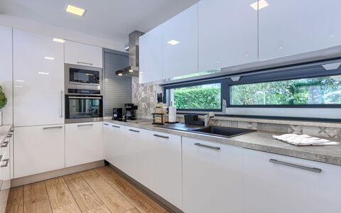 Frani: Kitchen, Countertop, Kitchen Appliance, Interior Design, Major Appliance, Flooring, Cabinetry, Ceiling, Light Fixture, Plumbing Fixture