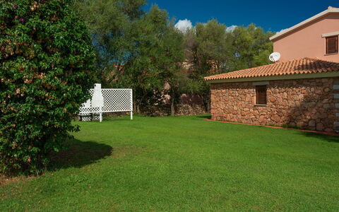 San Teodoro Apartments: Garden, Shade, Lawn, Backyard, Swimming Pool, Landscaping, Yard, Hacienda, Farmhouse