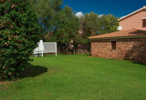 San Teodoro Apartments: Garden, Shade, Lawn, Backyard, Swimming Pool, Landscaping, Yard, Hacienda, Farmhouse