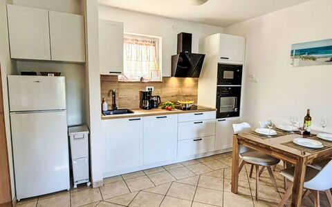 Mirta: Furniture, Kitchen Appliance, Kitchen, Major Appliance, Flooring, Countertop, Interior Design, Wood, Floor, Cabinetry