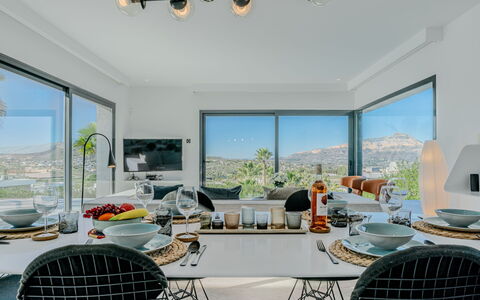 Leda: Furniture, Interior Design, Chair, Table, Kitchen & Dining Room Table, Ceiling, Light Fixture, Dining Room, Houseplant, Restaurant