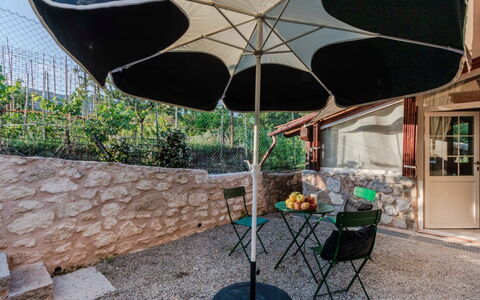 Serena: Umbrella, Shade, Outdoor Furniture, Chair, Outdoor Table, Backyard, Patio, Houseplant, Courtyard