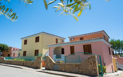 Violet Residence In Orosei: Wall, Building, Window, Residential Area, Facade, Home, Architecture, Neighbourhood, Town, House