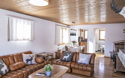 Chesa Primula: Furniture, Interior Design, Wood, Ceiling, Flooring, Room, Living Room, Floor, Couch, Lighting