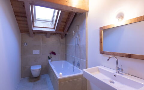 Chalet le Hameau: Bathroom, Plumbing Fixture, Flooring, Wood, Floor, Interior Design, Bathtub, Tap, Sink, Plumbing