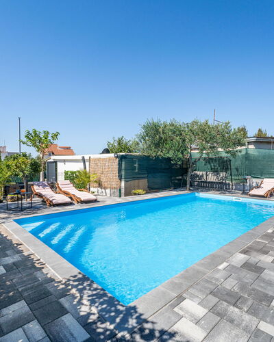 Marijana: Blue, Swimming Pool, Outdoor Furniture, Composite Material, Resort, Leisure, Flagstone, Shade, Water Feature, Tile