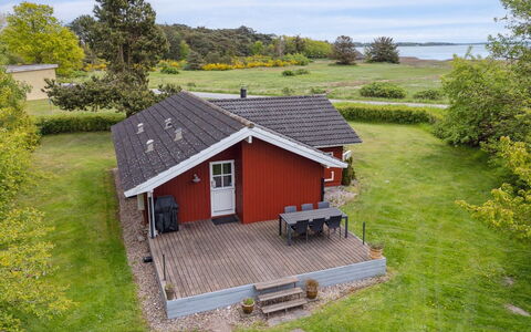 Hjalmine - 225M from the Sea: Vegetation, Shrub, Spring, Cottage, Garden, Shade, Backyard, Yard, Chair