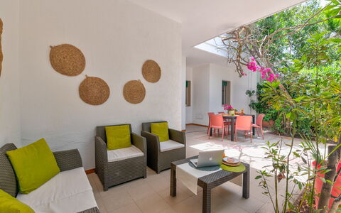 Villa Coralia: Furniture, Flooring, Interior Design, Floor, Chair, Ceiling, Room, Living Room, Houseplant, Kitchen & Dining Room Table