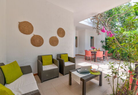 Villa Coralia: Furniture, Flooring, Interior Design, Floor, Chair, Ceiling, Room, Living Room, Houseplant, Kitchen & Dining Room Table