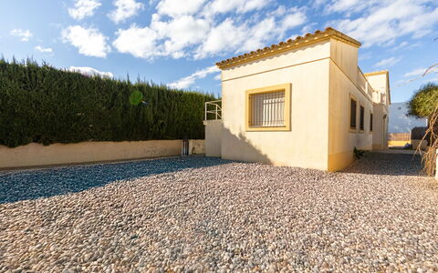 Golfa: Building, House, Wall, Window, Roof, Home, Residential Area, Facade, Shrub