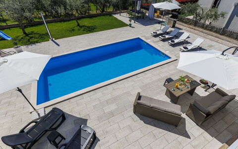 Storija: Swimming Pool, Outdoor Furniture, Resort, Leisure, Sunlounger, Umbrella, Recreation, Chair, Chaise Longue, Hotel