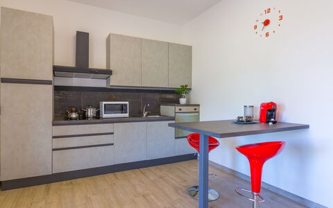 Villa Eufriama: Furniture, Kitchen, Flooring, Countertop, Kitchen Appliance, Interior Design, Wood, Cabinetry, Floor, Major Appliance