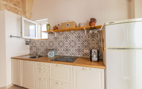 Dimora Storica: Kitchen, Flooring, Interior Design, Wood, Floor, Major Appliance, Kitchen Appliance, Countertop, Cabinetry, Furniture