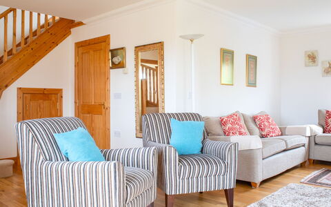 Creagan: Furniture, Interior Design, Flooring, Couch, Floor, Wood, Room, Living Room, Textile, Home