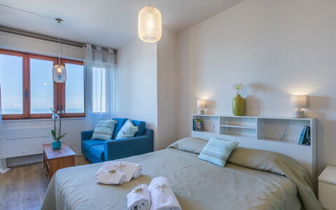 Mediterraneo: Bed, Furniture, Interior Design, Bedroom, Bedding, Floor, Bed Sheet, Flooring, Room, Wall