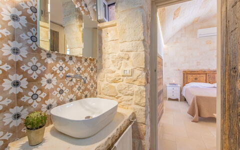 Lamia Del Vespro: Flooring, Interior Design, Floor, Ceiling, Plumbing Fixture, Tile, Bathroom, Stone Wall, Plumbing