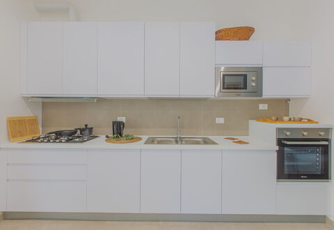 Casa Nonna Netta: Kitchen, Kitchen Appliance, Countertop, Major Appliance, Interior Design, Wood, Cabinetry, Flooring, Kitchen Stove, Stove